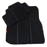 Black Floor Mats for BMW 1 Series E82 (2004-2013) installed in vehicle, showcasing custom fit and premium quality.