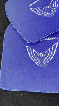 Tappetini blu per auto Pontiac FireBird (1993-2002) con logo Trans Am