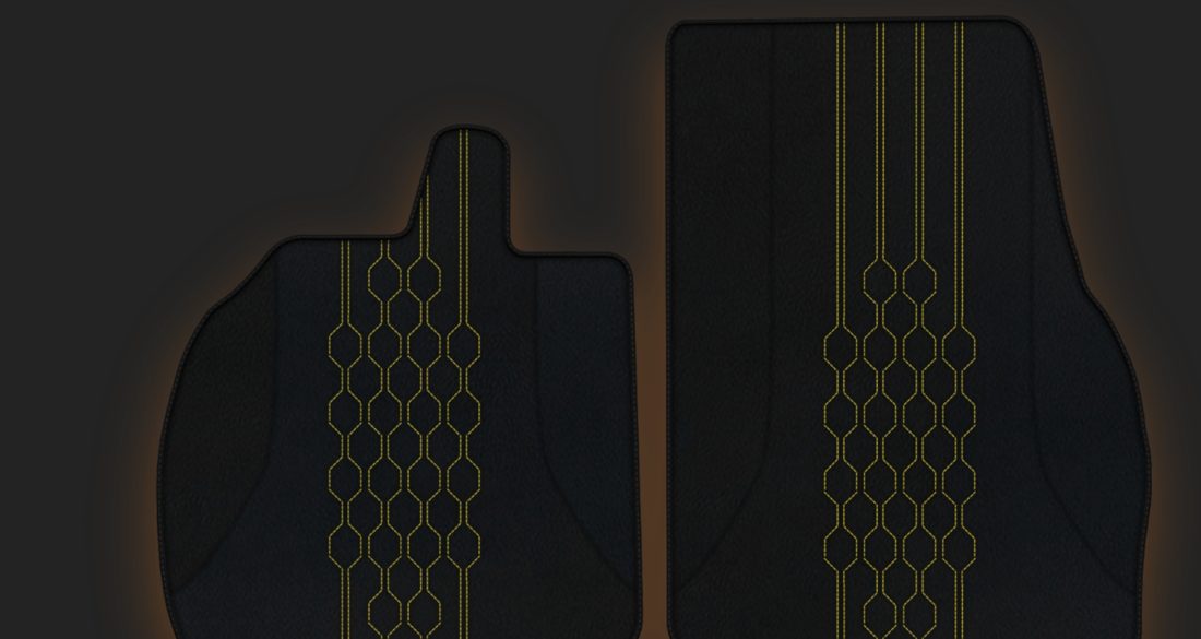 Black floor mats with yellow stitching, the live configurator preview